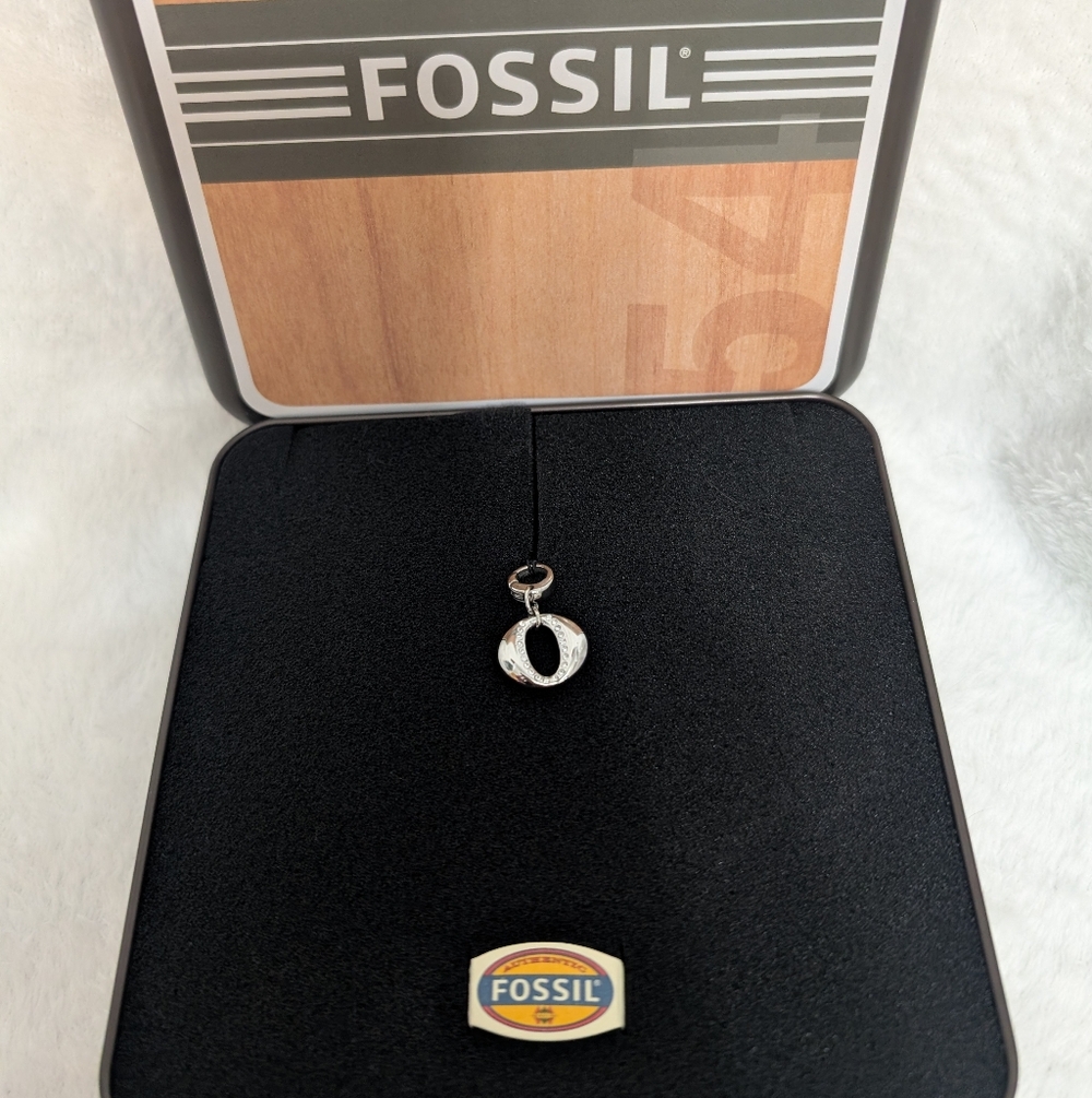 Fossil Charm In Tin And Box